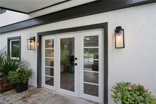 front of property with a garage, an outdoor structure, and a front yard