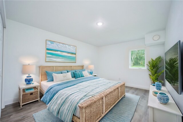 bedroom with wood-type flooring