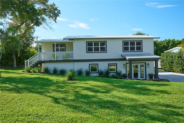 view of front of property featuring a porch and a front yard