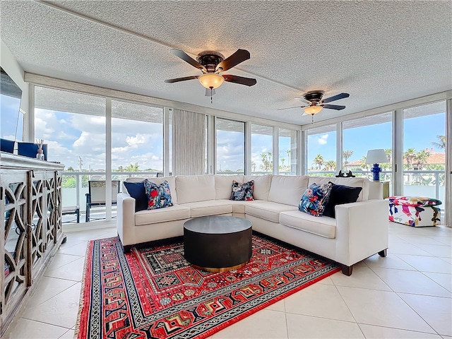 sunroom / solarium with a wealth of natural light and ceiling fan