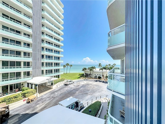 exterior space with a water view and a balcony