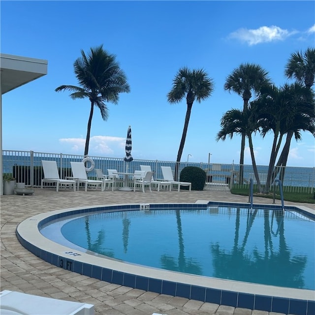 view of swimming pool featuring a patio area