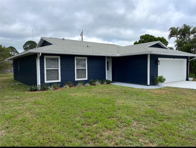 ranch-style home with a garage, driveway, and a front lawn