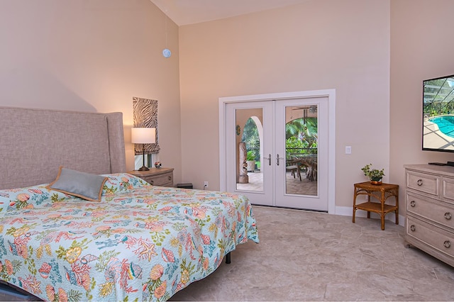 bedroom featuring access to exterior, french doors, and high vaulted ceiling