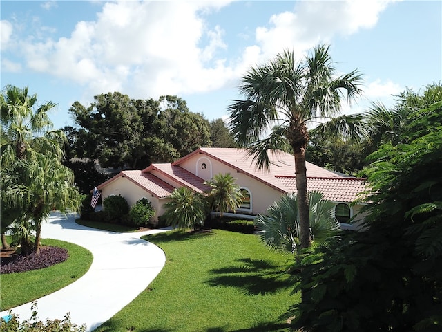 view of property exterior with a lawn