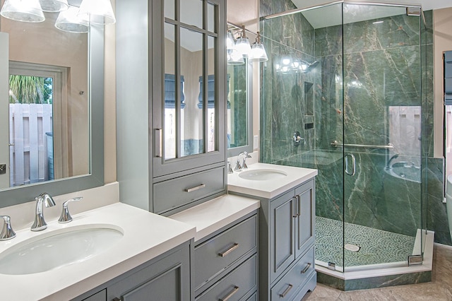 bathroom with tile patterned flooring, vanity, and a shower with shower door