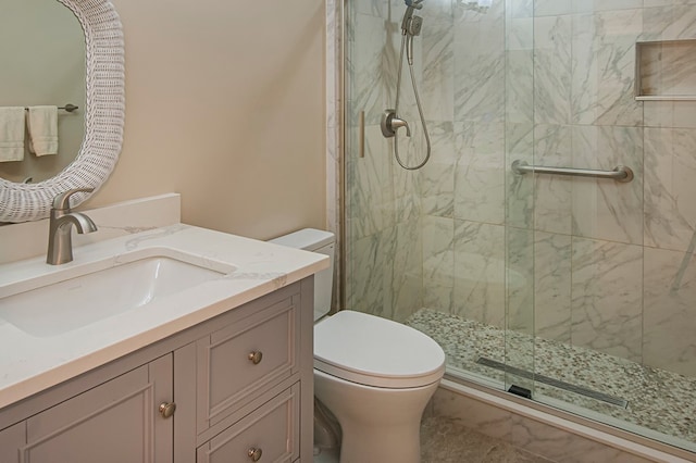 bathroom with walk in shower, tile patterned flooring, vanity, and toilet