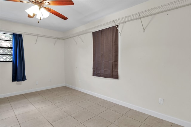 walk in closet featuring light tile patterned floors and ceiling fan