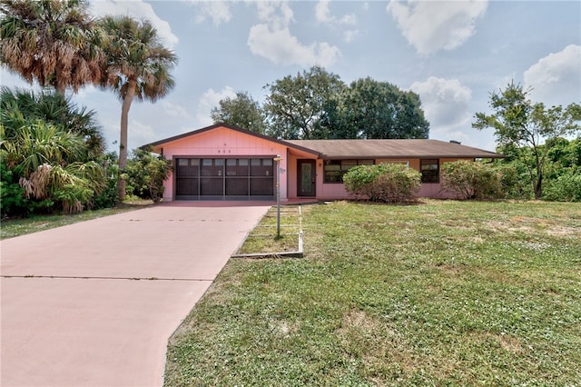 single story home with a front yard and a garage