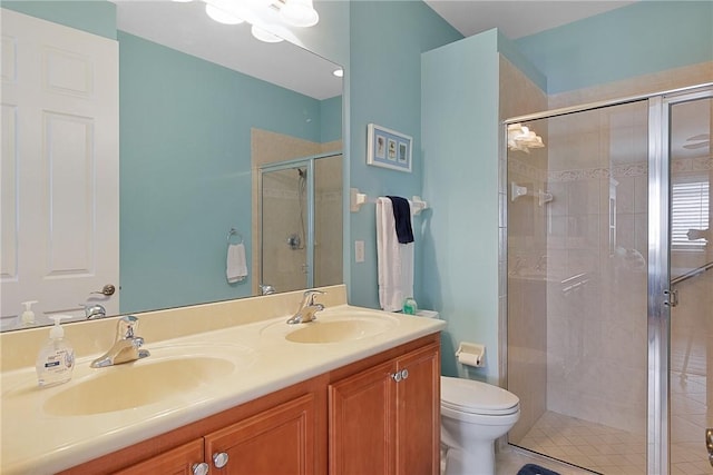 bathroom featuring vanity, toilet, and walk in shower