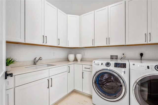 10 Strand Dr, Vero Beach, FL 32963 - laundry area featuring cabinet space and washing machine and dryer