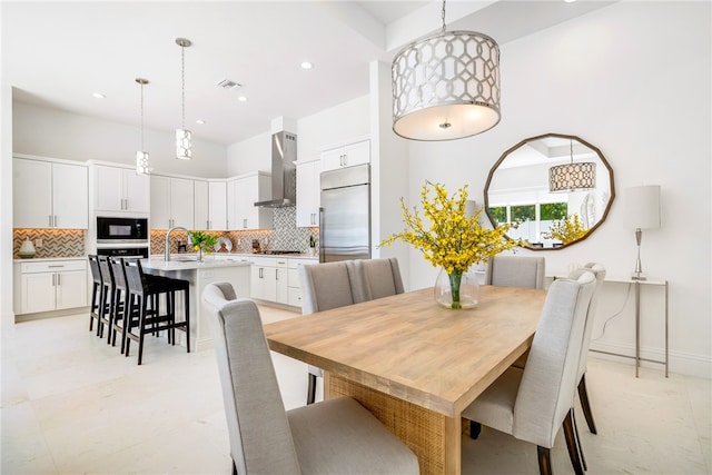 dining room featuring light tile patterned flooring and sink