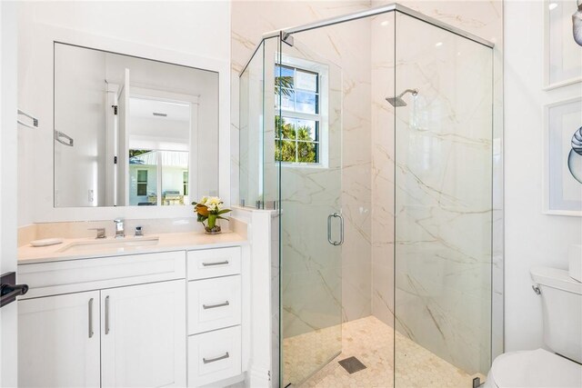 10 Strand Dr, Vero Beach, FL 32963 - bathroom with toilet, a marble finish shower, and vanity