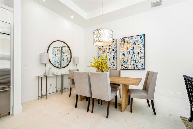 10 Strand Dr, Vero Beach, FL 32963 - dining room featuring recessed lighting, baseboards, tile patterned floors, and a tray ceiling