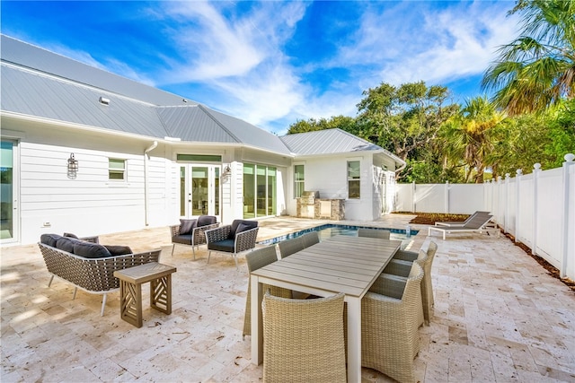 view of patio with french doors and an outdoor living space