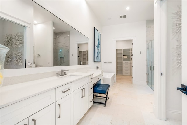 bathroom featuring vanity and a shower with shower door