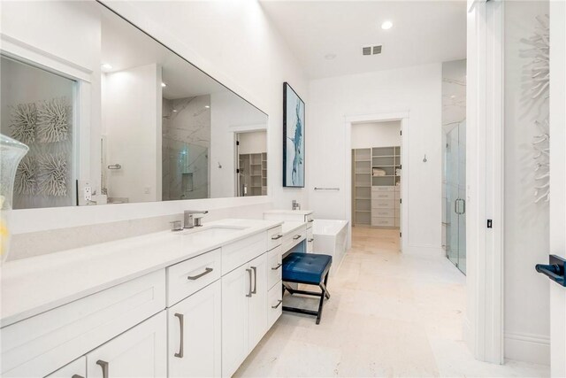 10 Strand Dr, Vero Beach, FL 32963 - full bathroom with a marble finish shower, vanity, and recessed lighting