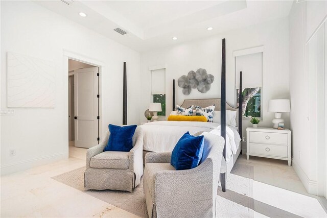 10 Strand Dr, Vero Beach, FL 32963 - bedroom featuring recessed lighting, a tray ceiling, and baseboards