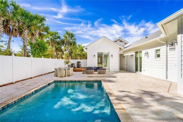 10 Strand Dr, Vero Beach, FL 32963 - view of swimming pool featuring a patio, a fenced backyard, and outdoor lounge area