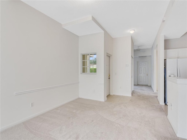 carpeted empty room with ceiling fan