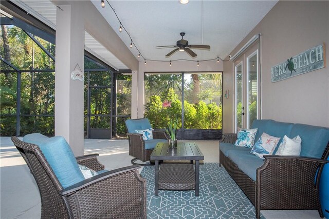 view of swimming pool with a lanai, a patio area, french doors, and ceiling fan