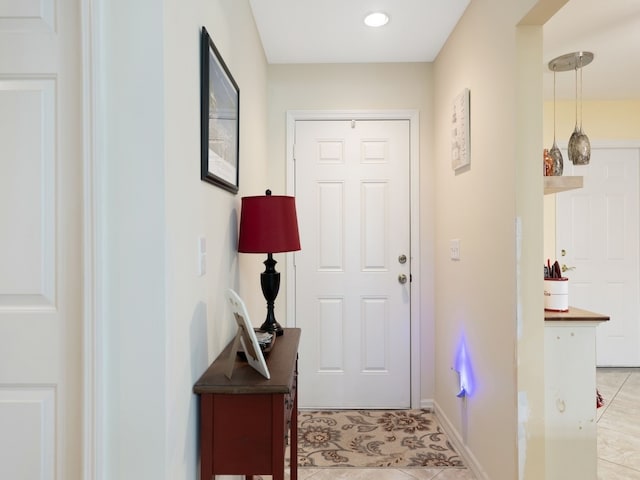 entryway featuring light tile patterned floors