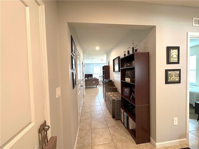 4173 Keeson Cir, Vero Beach, FL 32967 - hallway featuring light tile patterned floors and baseboards