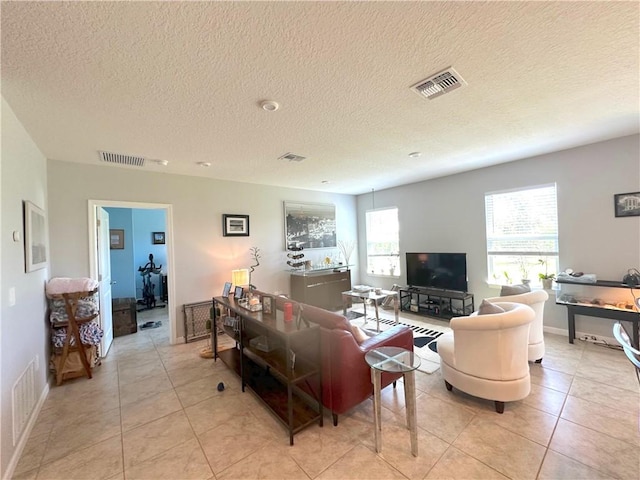 4173 Keeson Cir, Vero Beach, FL 32967 - living area with light tile patterned floors and a textured ceiling