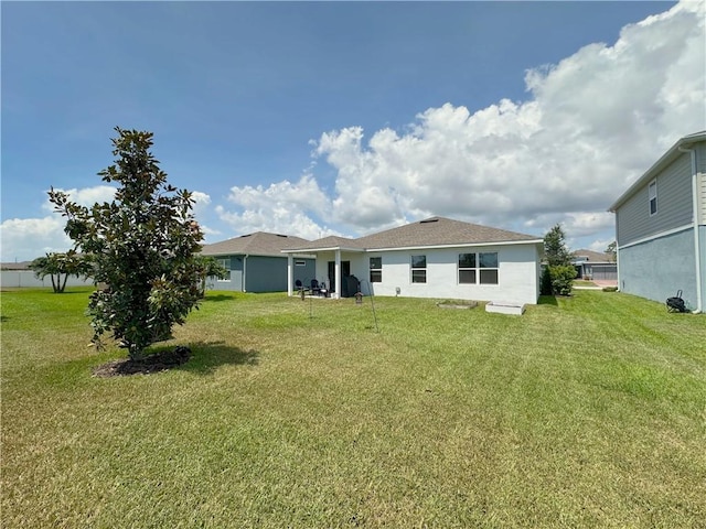 4173 Keeson Cir, Vero Beach, FL 32967 - rear view of property with a yard and stucco siding