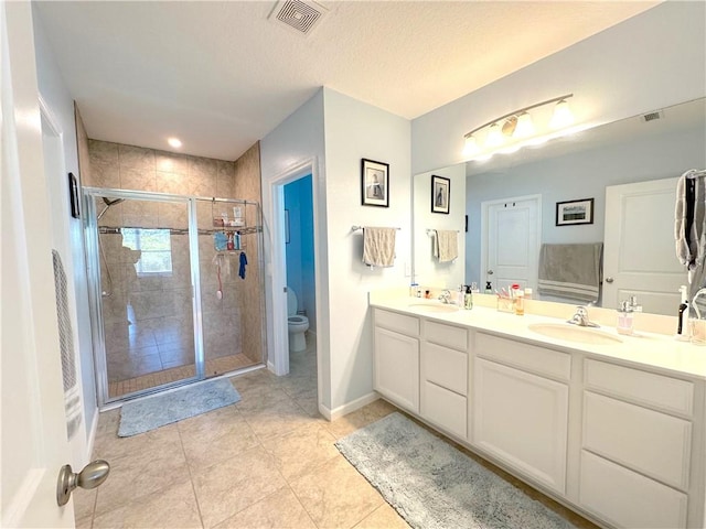 4173 Keeson Cir, Vero Beach, FL 32967 - bathroom featuring double vanity, a stall shower, and tile patterned floors