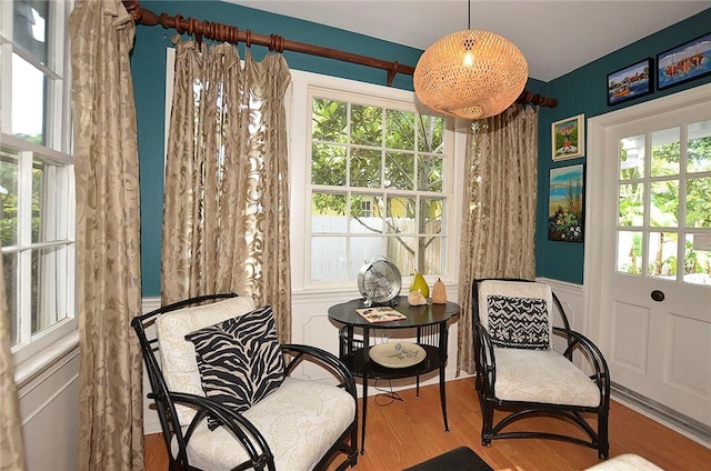 living area with hardwood / wood-style flooring