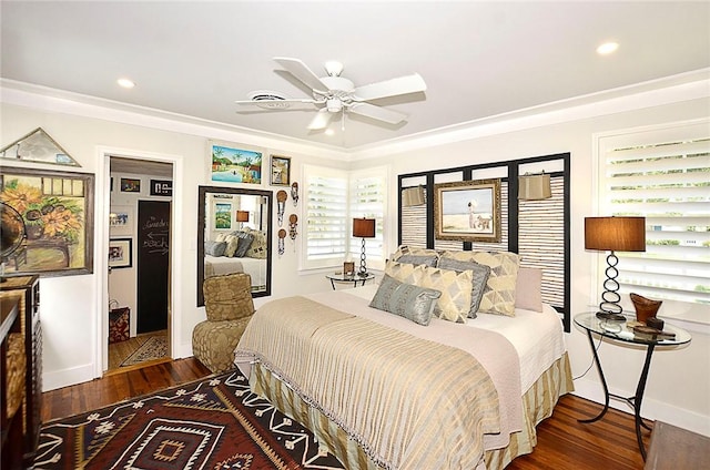 bedroom featuring crown molding, ceiling fan, and dark hardwood / wood-style floors