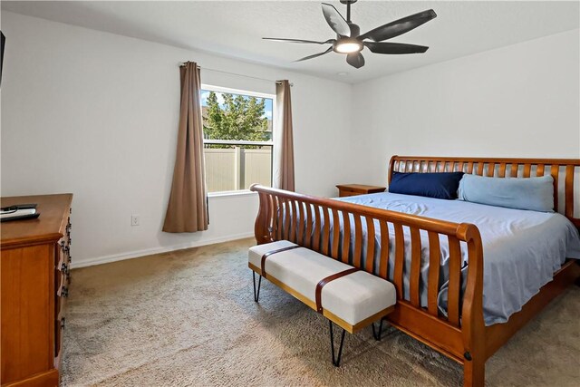 8646 102nd Ave, Vero Beach, FL 32967 - carpeted bedroom featuring baseboards and a ceiling fan