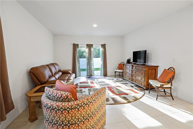8646 102nd Ave, Vero Beach, FL 32967 - living room with light tile patterned floors and recessed lighting