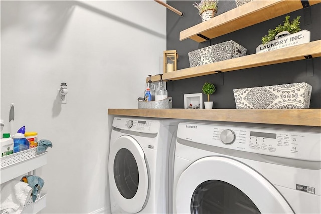 washroom featuring washing machine and dryer