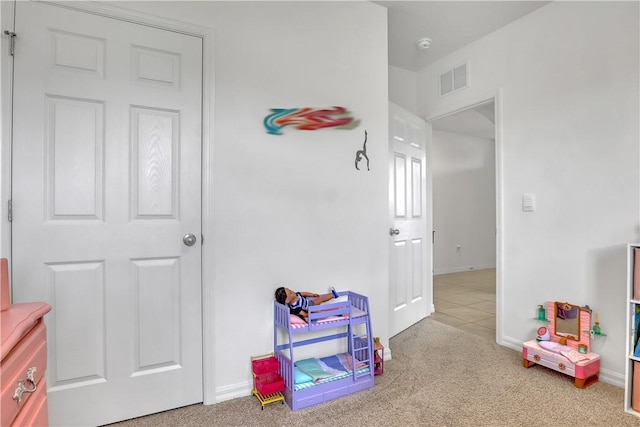 playroom with light colored carpet