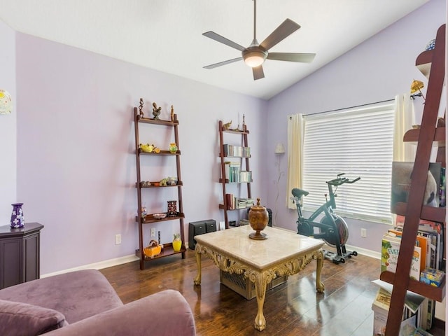 home office with ceiling fan, dark wood-type flooring, and vaulted ceiling