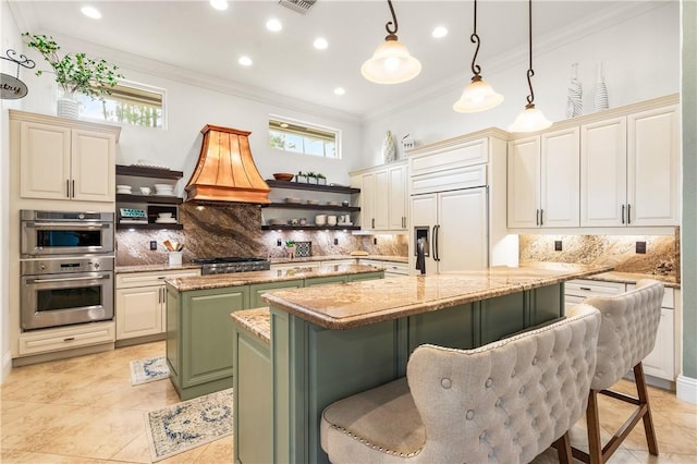 kitchen with paneled built in refrigerator, a kitchen island, crown molding, and open shelves