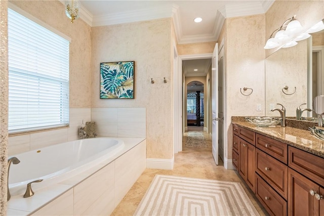 full bathroom with tile patterned floors, a garden tub, ornamental molding, and vanity