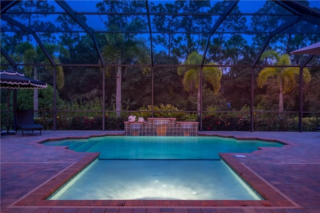 pool featuring a lanai and a patio area