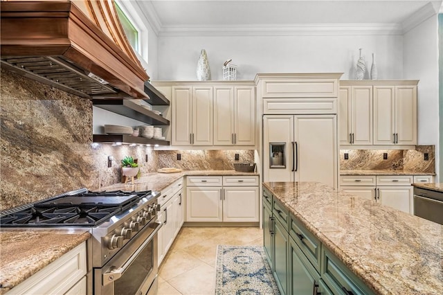 kitchen with light stone counters, custom exhaust hood, crown molding, high quality appliances, and backsplash