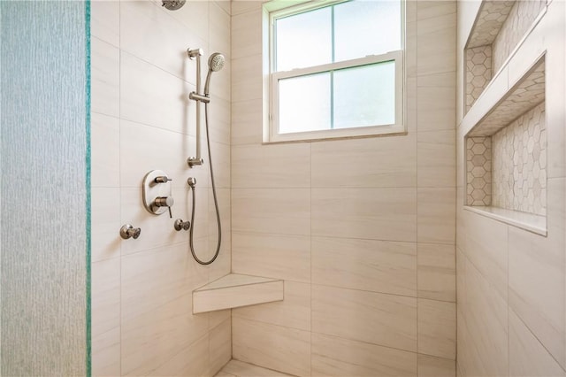 bathroom featuring tiled shower