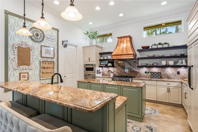 kitchen with a healthy amount of sunlight, open shelves, green cabinets, and ornamental molding