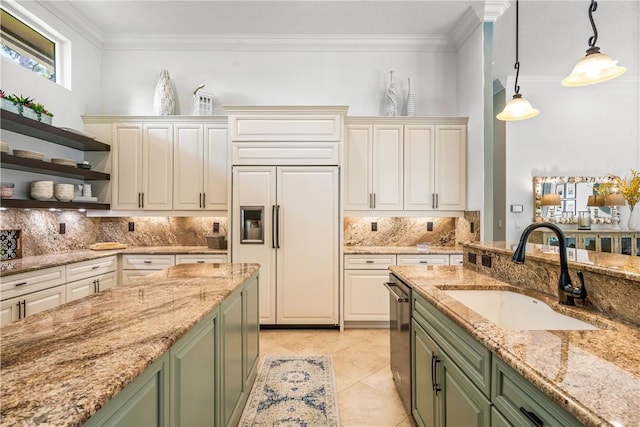 kitchen with crown molding, green cabinetry, stainless steel dishwasher, paneled fridge, and a sink