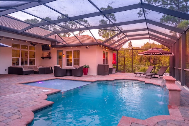 pool with a patio area, an outdoor living space, a lanai, and ceiling fan