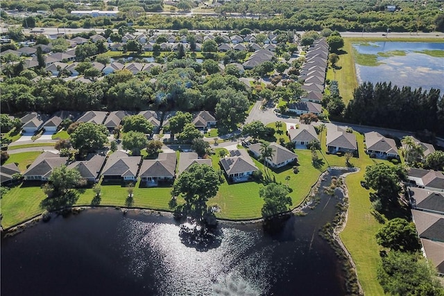 bird's eye view featuring a residential view and a water view