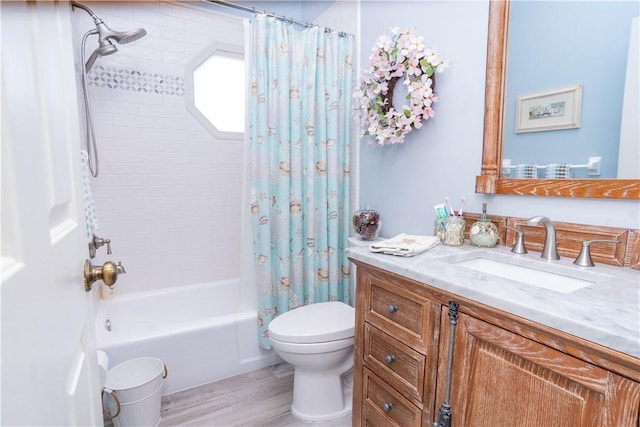 full bathroom with vanity, toilet, wood-type flooring, and shower / tub combo