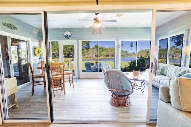 sunroom / solarium featuring visible vents and wood finished floors
