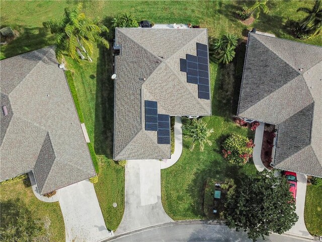 back of house with a yard, a patio, and a sunroom