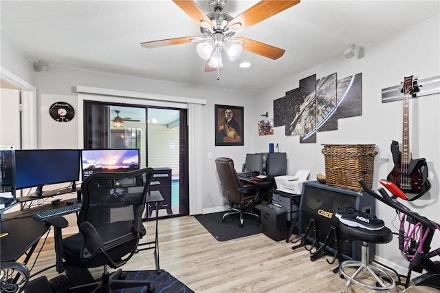 home office with light hardwood / wood-style floors